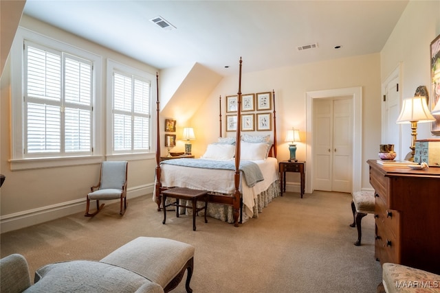 bedroom with light carpet and a closet