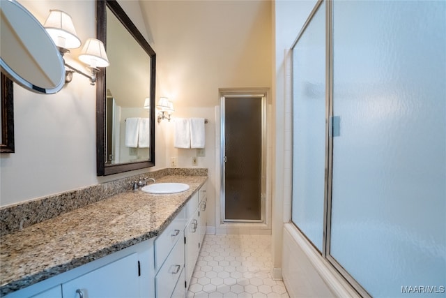 bathroom with tile patterned flooring and vanity