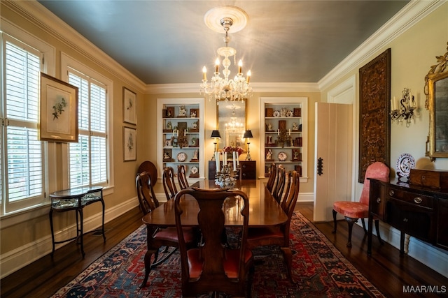 dining room featuring a notable chandelier, built in shelves, dark hardwood / wood-style floors, and ornamental molding