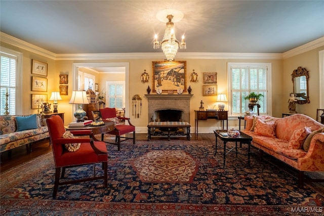 living room featuring wood-type flooring, a chandelier, and ornamental molding