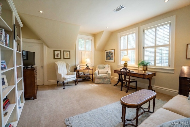 sitting room featuring light carpet and vaulted ceiling