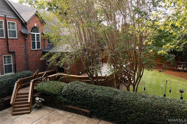 view of yard featuring a wooden deck