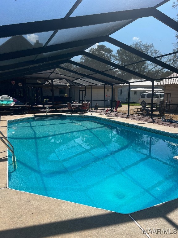 view of pool with a lanai