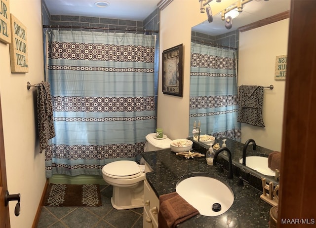 bathroom with vanity, curtained shower, tile patterned floors, and toilet