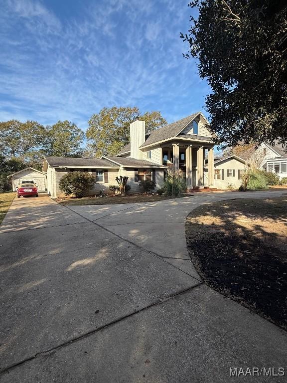 view of front of house featuring a garage and covered porch