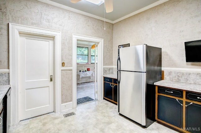 kitchen featuring ceiling fan, crown molding, and stainless steel fridge