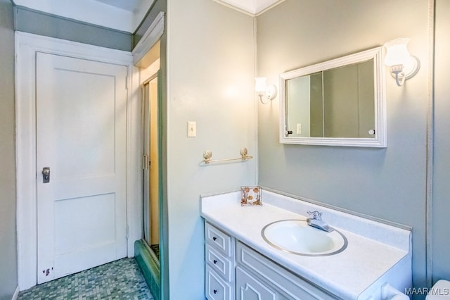 bathroom with walk in shower and vanity