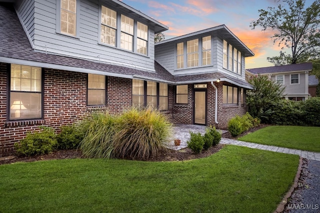 view of front of house with a lawn