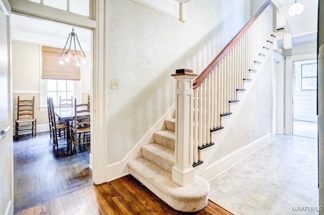 stairs featuring hardwood / wood-style flooring