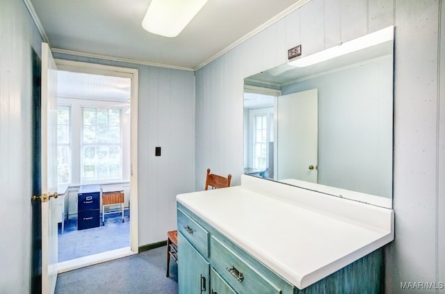 bathroom with vanity and ornamental molding