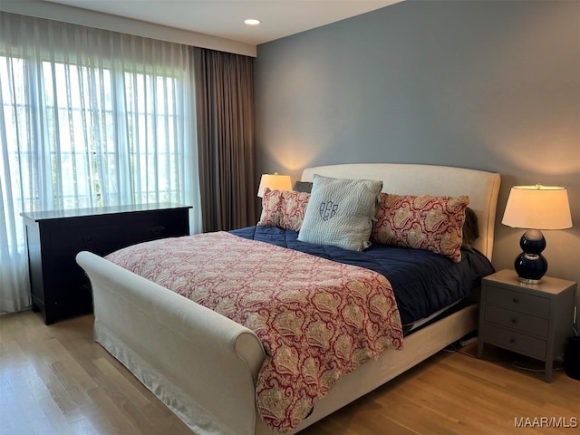 bedroom featuring light wood-type flooring