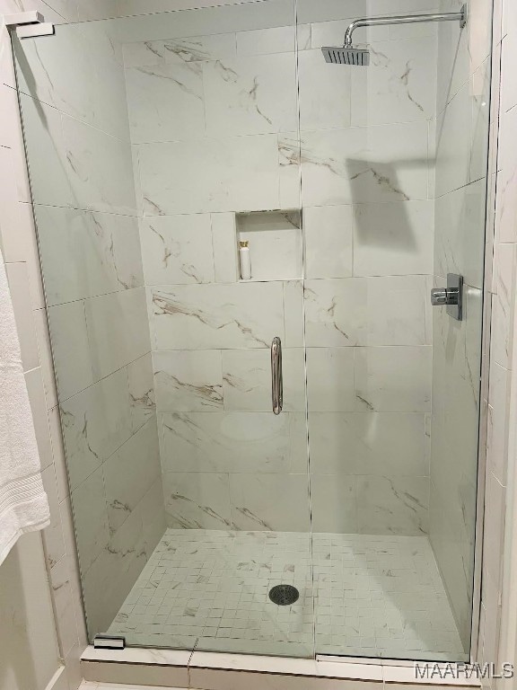 bathroom featuring an enclosed shower