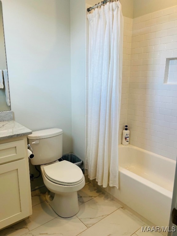 full bathroom featuring vanity, toilet, and shower / bathtub combination with curtain