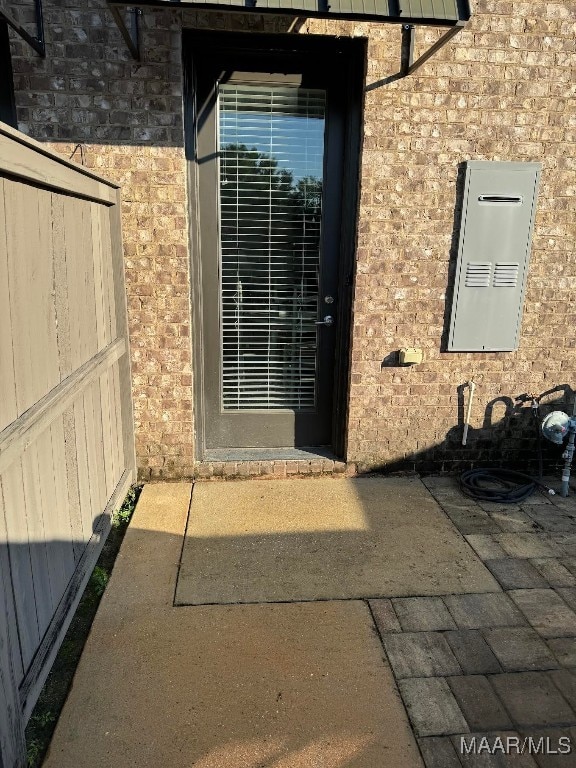 entrance to property featuring a patio area