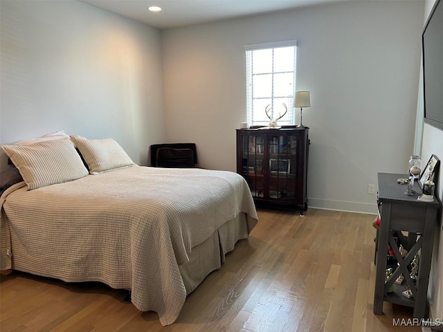 bedroom featuring light hardwood / wood-style flooring