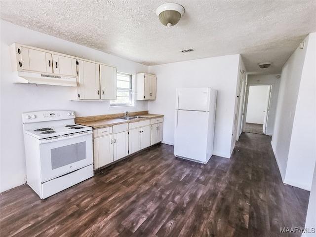 kitchen featuring white cabinetry, white appliances, a textured ceiling, dark hardwood / wood-style floors, and sink