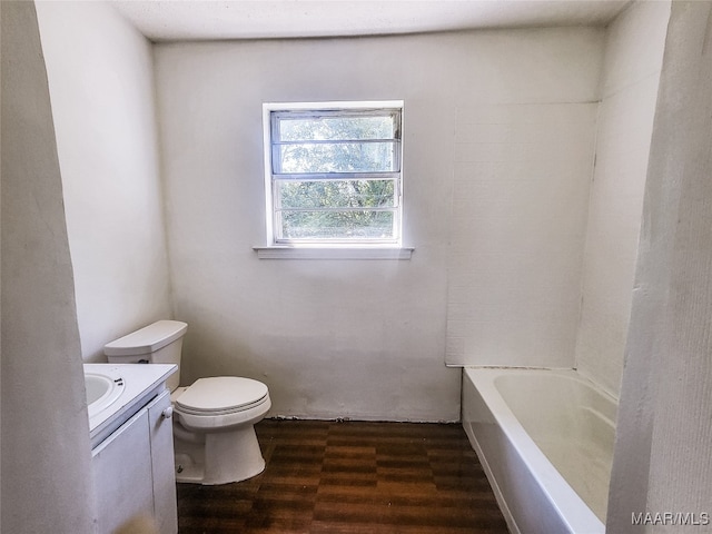 bathroom with wood-type flooring, vanity, and toilet