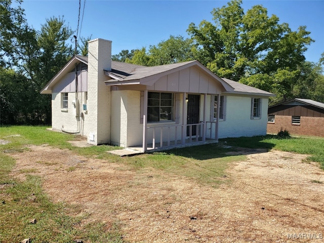 back of house with a yard