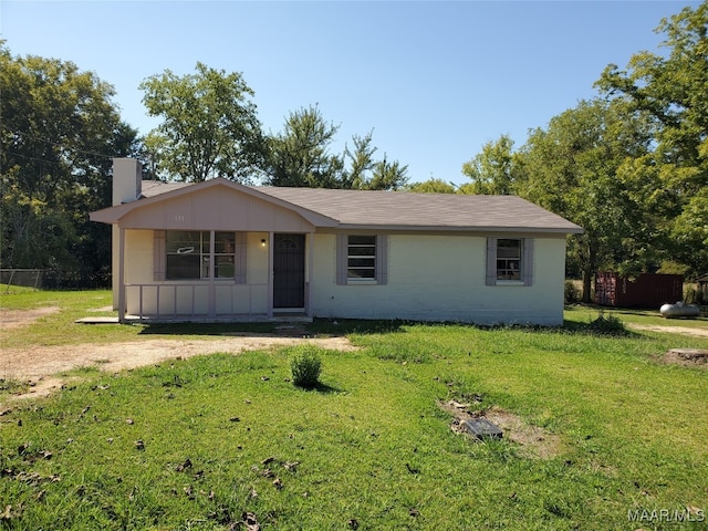 ranch-style home with a front lawn