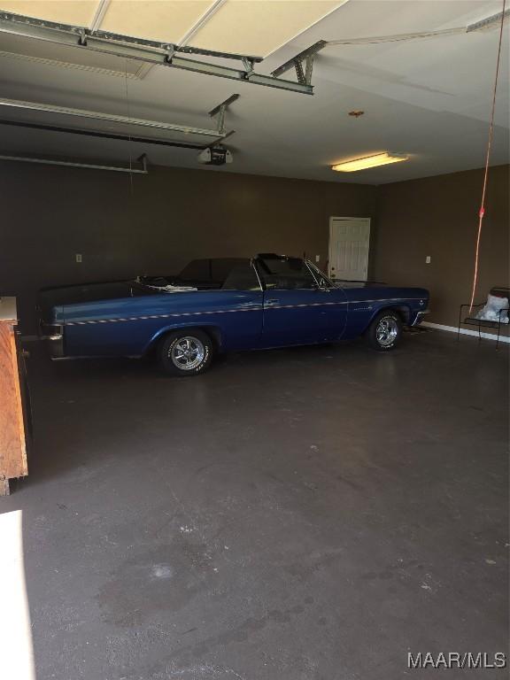 garage featuring a garage door opener