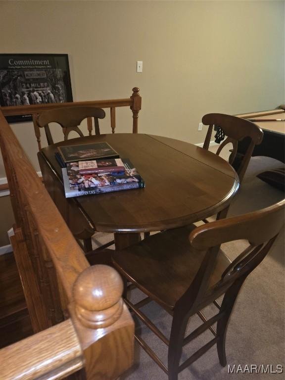 dining area featuring carpet flooring