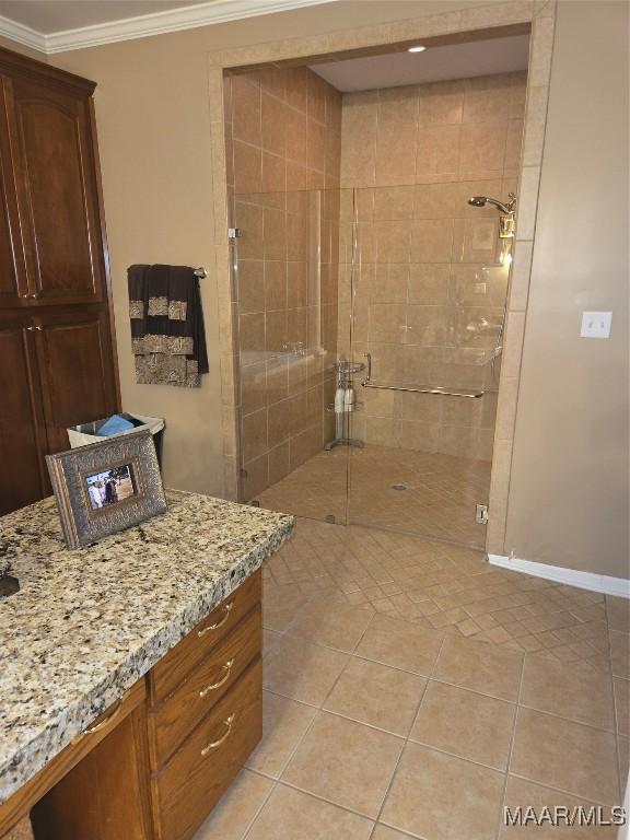 1715 County Road 2203rd Rd, Goshen, AL 36035 - full bath featuring crown molding, baseboards, a tile shower, vanity, and tile patterned flooring