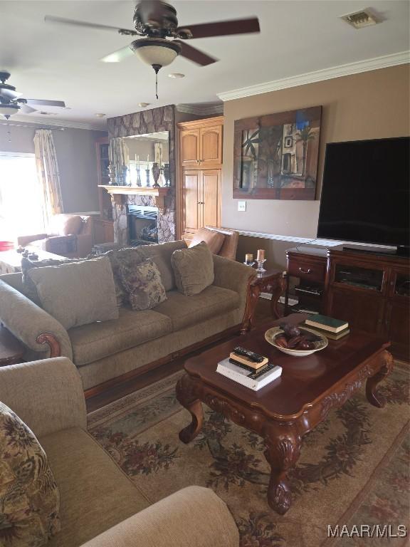 1715 County Road 2203rd Rd, Goshen, AL 36035 - living area with visible vents, crown molding, and a ceiling fan
