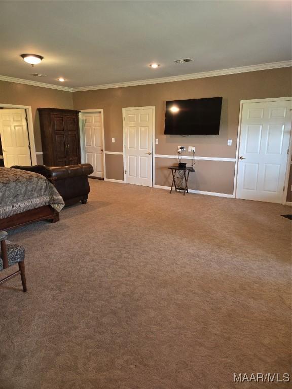 bedroom with carpet flooring and ornamental molding