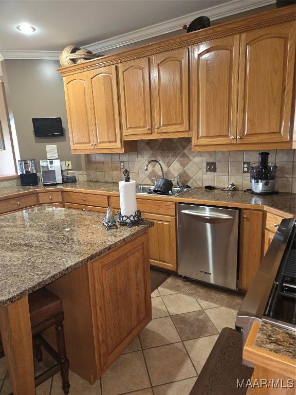 1715 County Road 2203rd Rd, Goshen, AL 36035 - kitchen with crown molding, backsplash, a breakfast bar area, stainless steel dishwasher, and light tile patterned floors