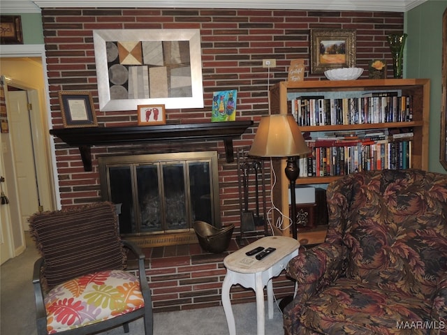 living room featuring crown molding, a fireplace, and carpet