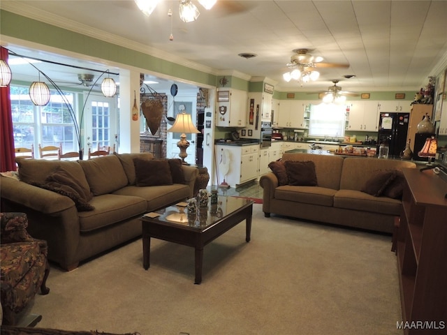 living room featuring crown molding, light carpet, and ceiling fan