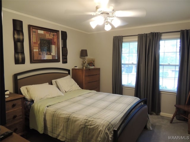 carpeted bedroom with ceiling fan and ornamental molding