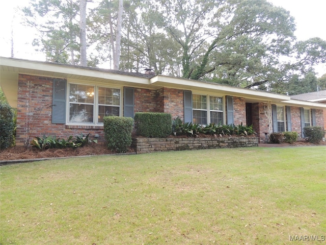 ranch-style home with a front yard