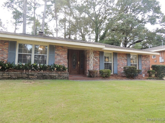 ranch-style house with a front lawn