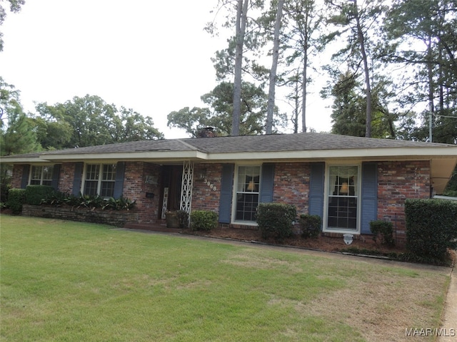 single story home featuring a front yard