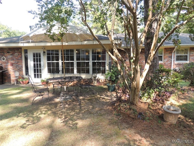 back of property featuring a patio