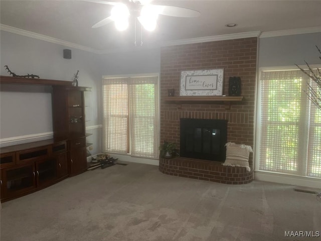 unfurnished living room featuring carpet, a brick fireplace, and crown molding