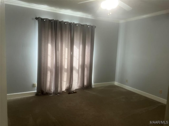 spare room featuring ornamental molding, a ceiling fan, and baseboards