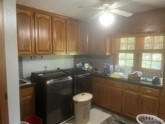 laundry room featuring cabinets, washing machine and dryer, and ceiling fan