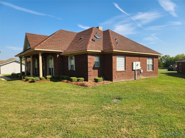 view of property exterior with a yard