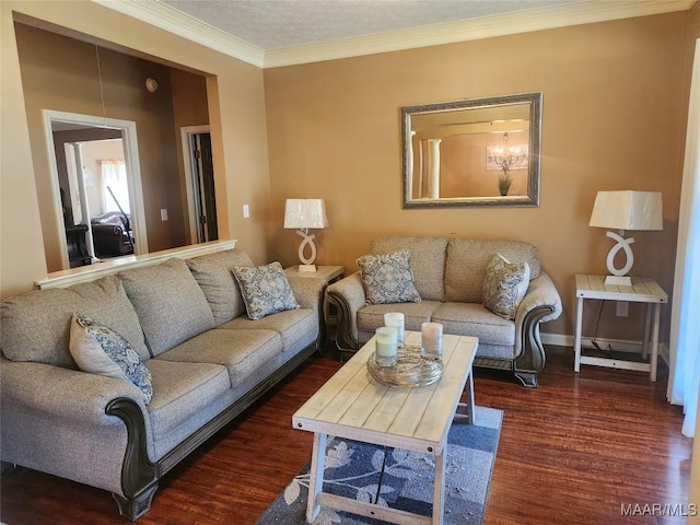 living room with crown molding, dark hardwood / wood-style flooring, and a chandelier