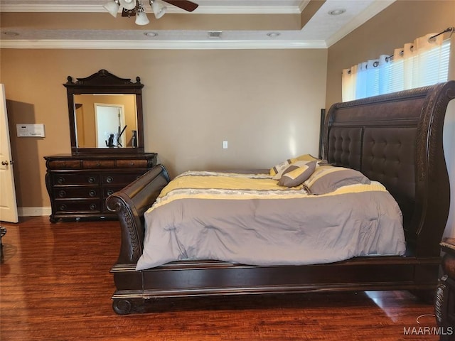 bedroom with ceiling fan, dark hardwood / wood-style flooring, and ornamental molding