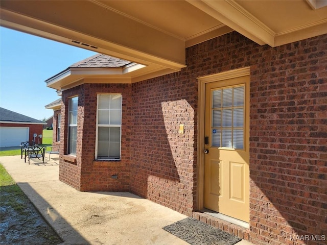 property entrance with a patio