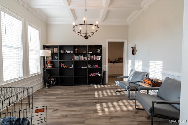 living area with coffered ceiling, a wealth of natural light, and wood-type flooring