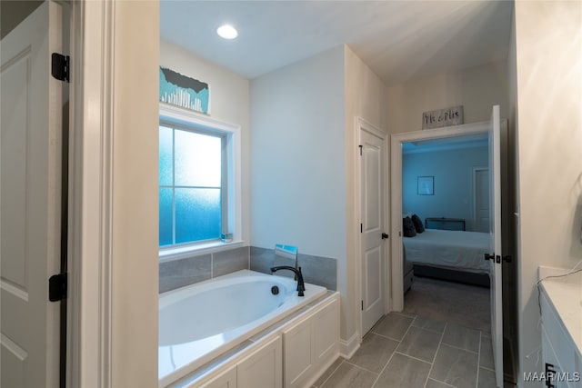 bathroom featuring a tub and vanity