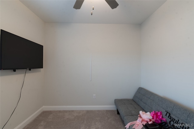 unfurnished room featuring ceiling fan and light colored carpet