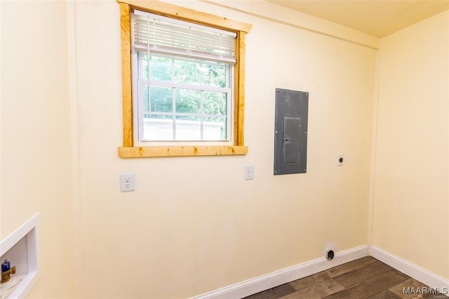 laundry room featuring electric panel, hookup for an electric dryer, laundry area, baseboards, and dark wood-style flooring