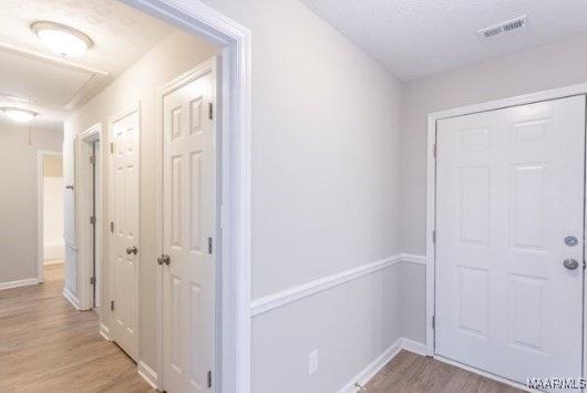 hallway featuring light wood-type flooring