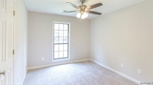 carpeted empty room with ceiling fan