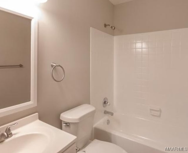 full bathroom featuring vanity, shower / bath combination, and toilet